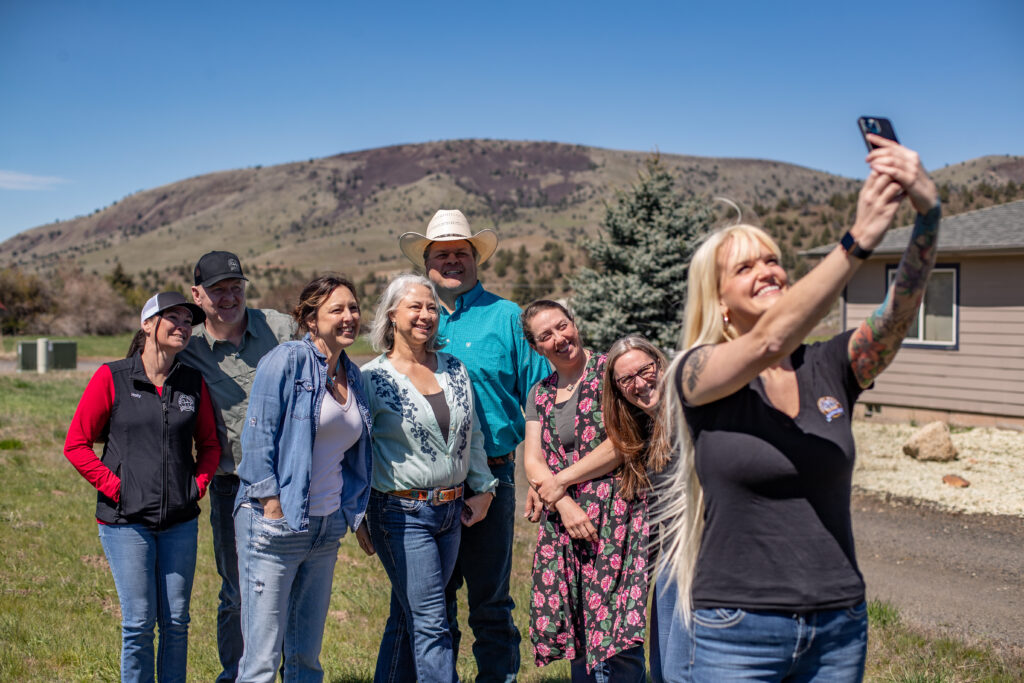 team selfie style photo with 8 people